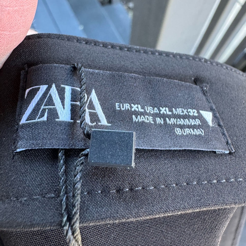 Zara black trousers with front slit.